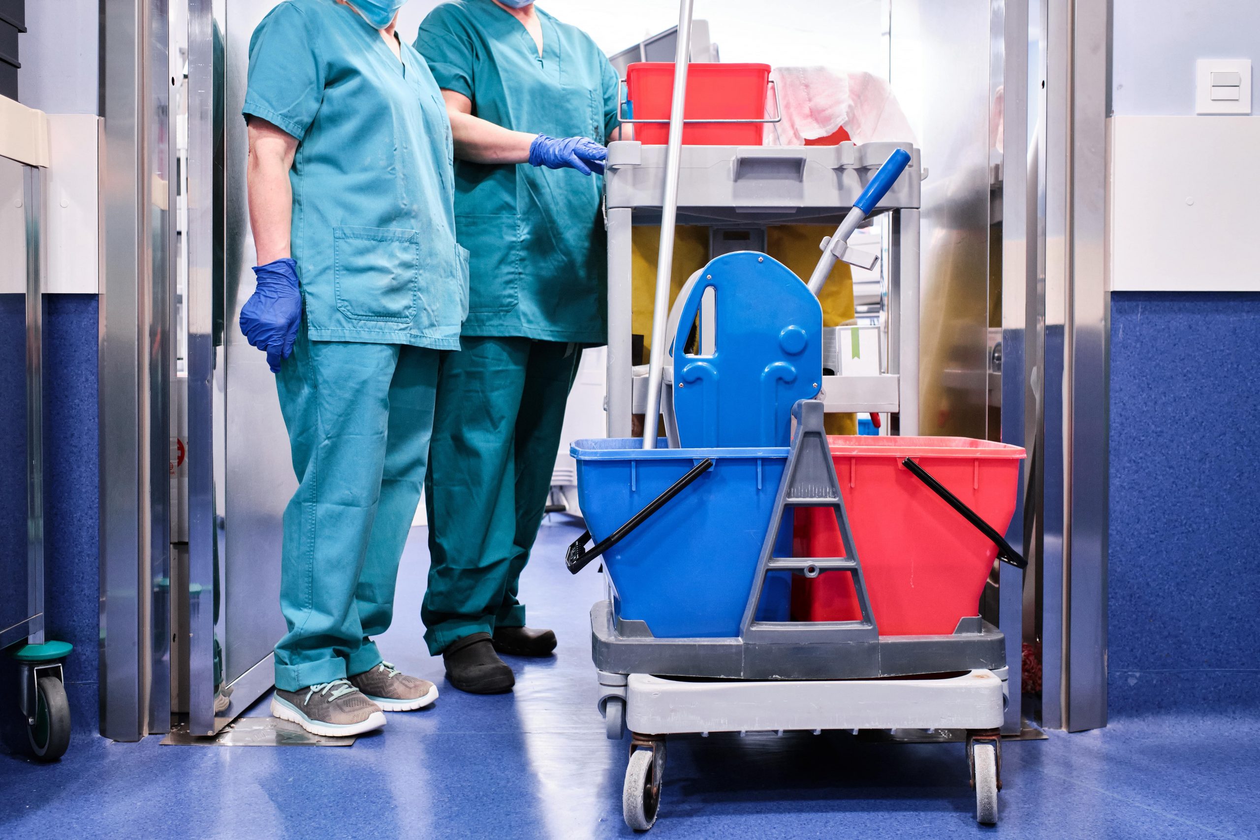 cleaning-staff-next-to-a-cleaning-cart-at-a-hospit-2022-03-15-18-43-37-utc-min